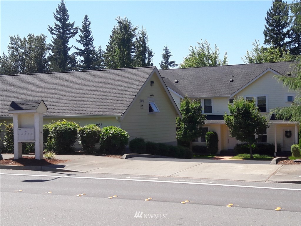 24057 Witte Road Southeast Maple Valley, WA 98038 - Photo 2 of 8 a view of a house and a yard