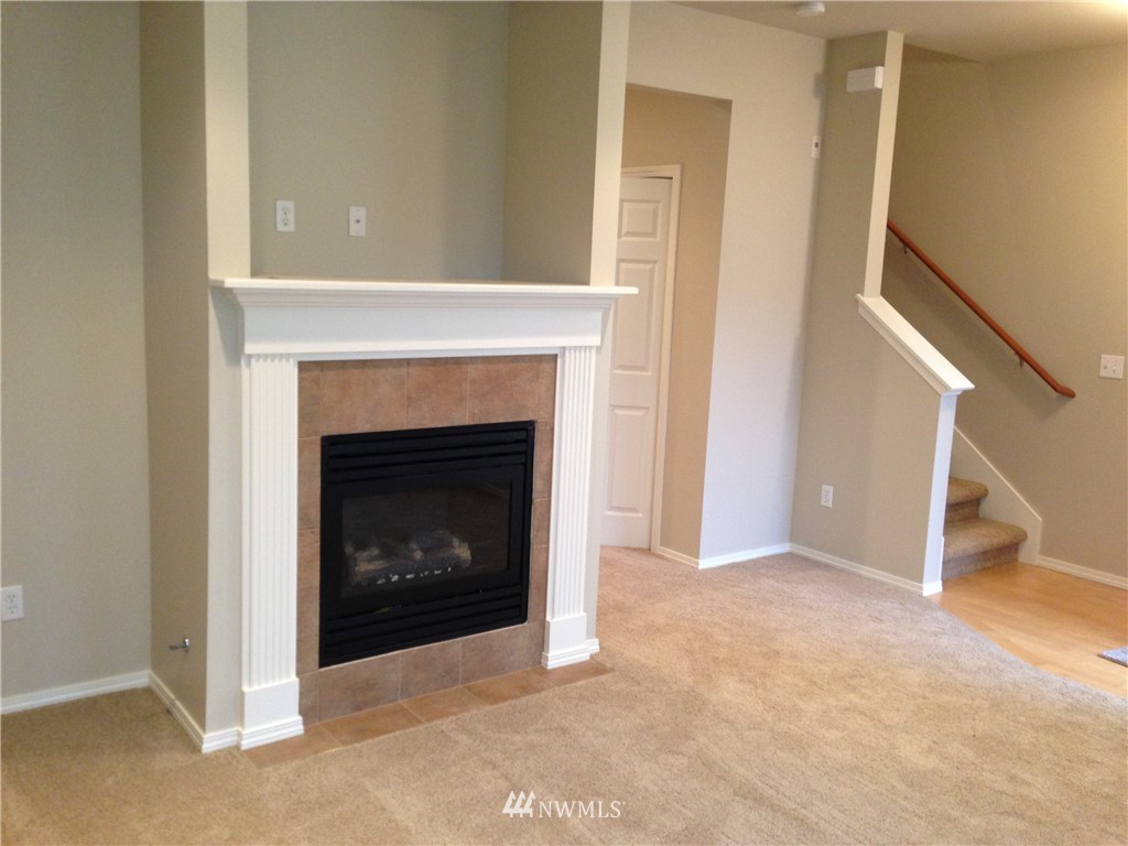 24057 Witte Road Southeast Maple Valley, WA 98038 - Photo 4 of 8 a living room with a fireplace