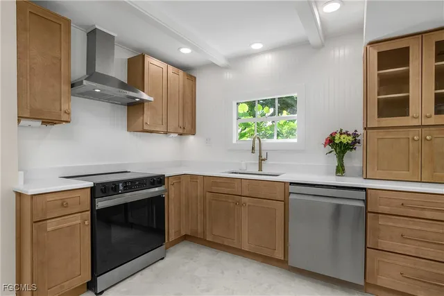 a kitchen with a sink stove and microwave