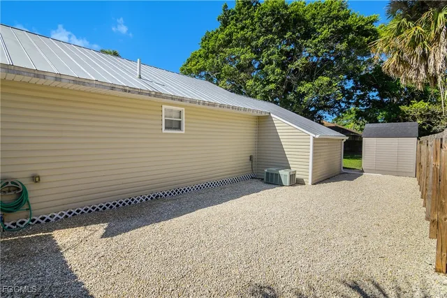 a view of a backyard of the house