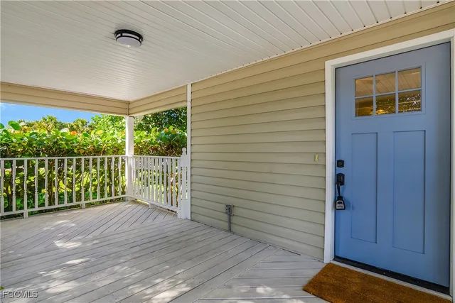 a view of a balcony with wooden floor