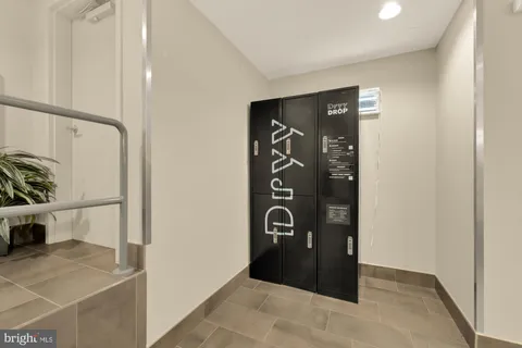 a view of a workspace with furniture and a bathroom