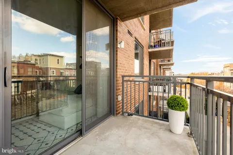 a view of a balcony with furniture