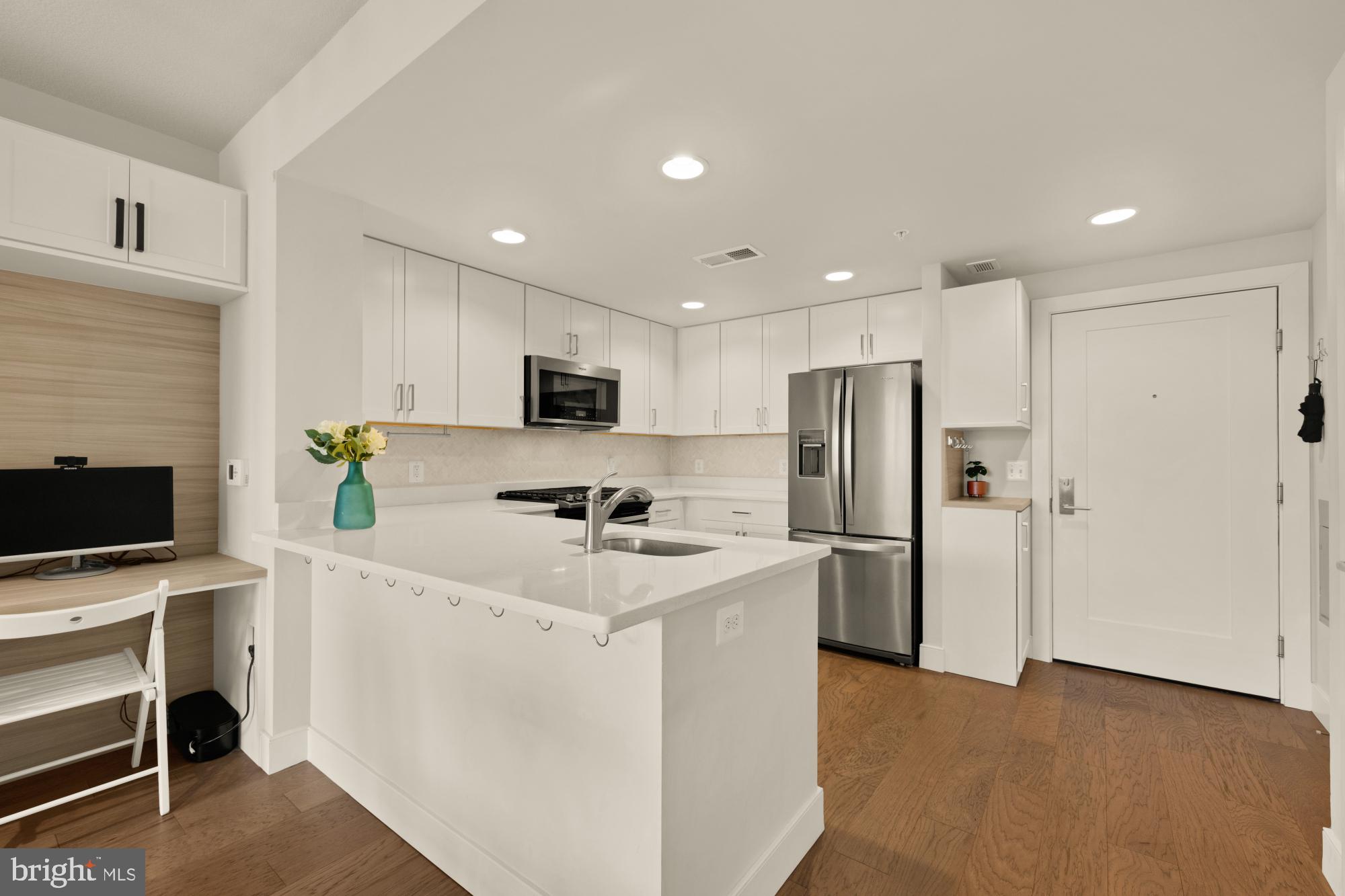 50 Florida Avenue Northeast, Unit 412 Washington, DC 20002 - Photo 5 of 29 a kitchen with stainless steel appliances a refrigerator sink and microwave