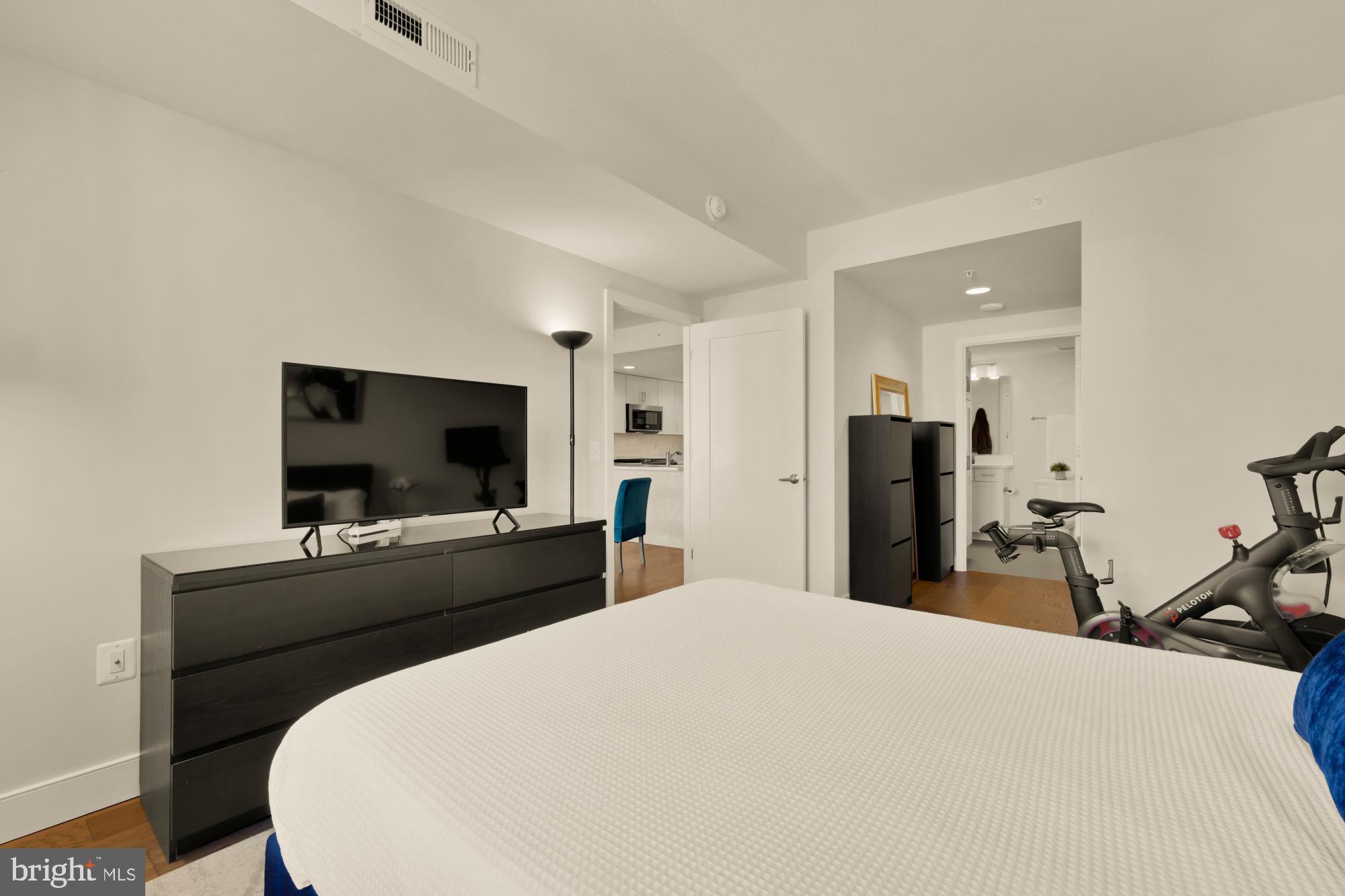 50 Florida Avenue Northeast, Unit 412 Washington, DC 20002 - Photo 8 of 29 a bedroom with a bed and a flat screen tv
