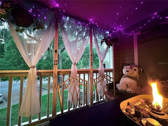 a spacious bedroom with bed and a chandelier