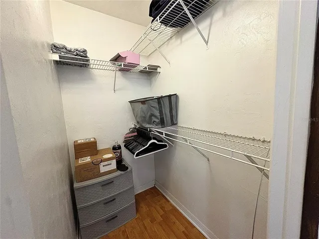 a bed room with a bed window and a chair