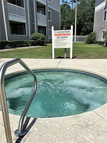 a view of a backyard with sitting area