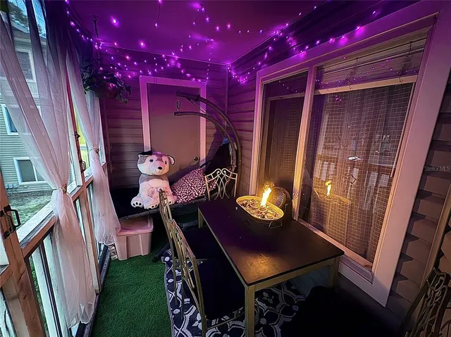 a view of swimming pool with furniture