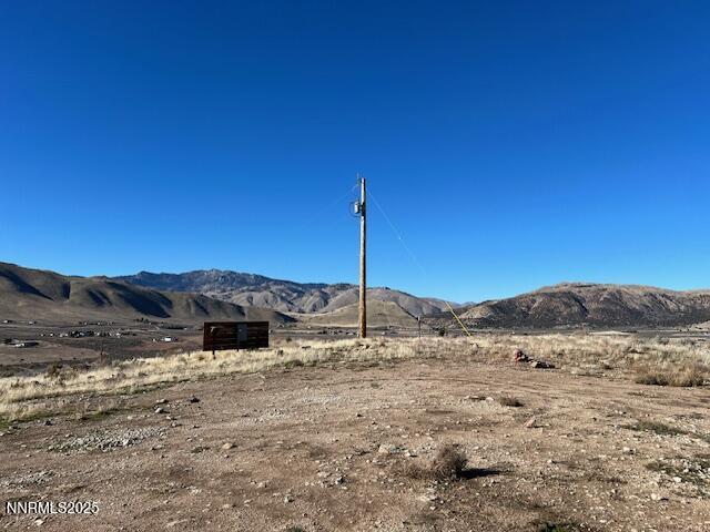 a view of a house with a mountain