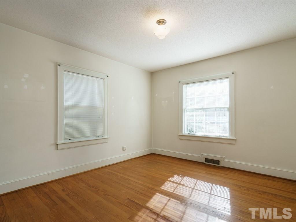 713 Kimbrough Street Raleigh, NC 27608 - Photo 18 of 25 an empty room with a window