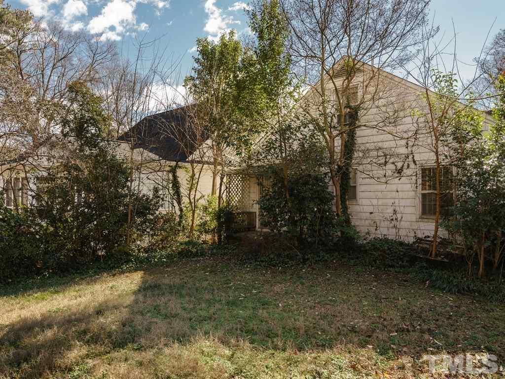 713 Kimbrough Street Raleigh, NC 27608 - Photo 24 of 25 a backyard of a house with lots of green space