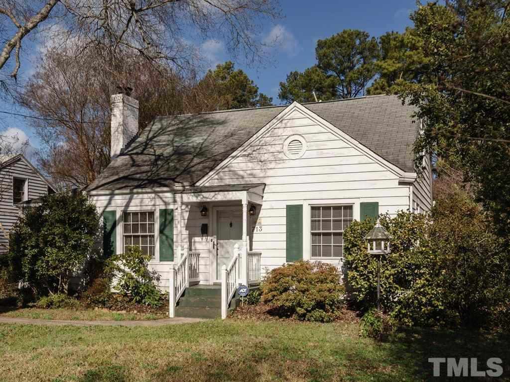 713 Kimbrough Street Raleigh, NC 27608 - Photo 25 of 25 a view of a white house next to a yard and large trees
