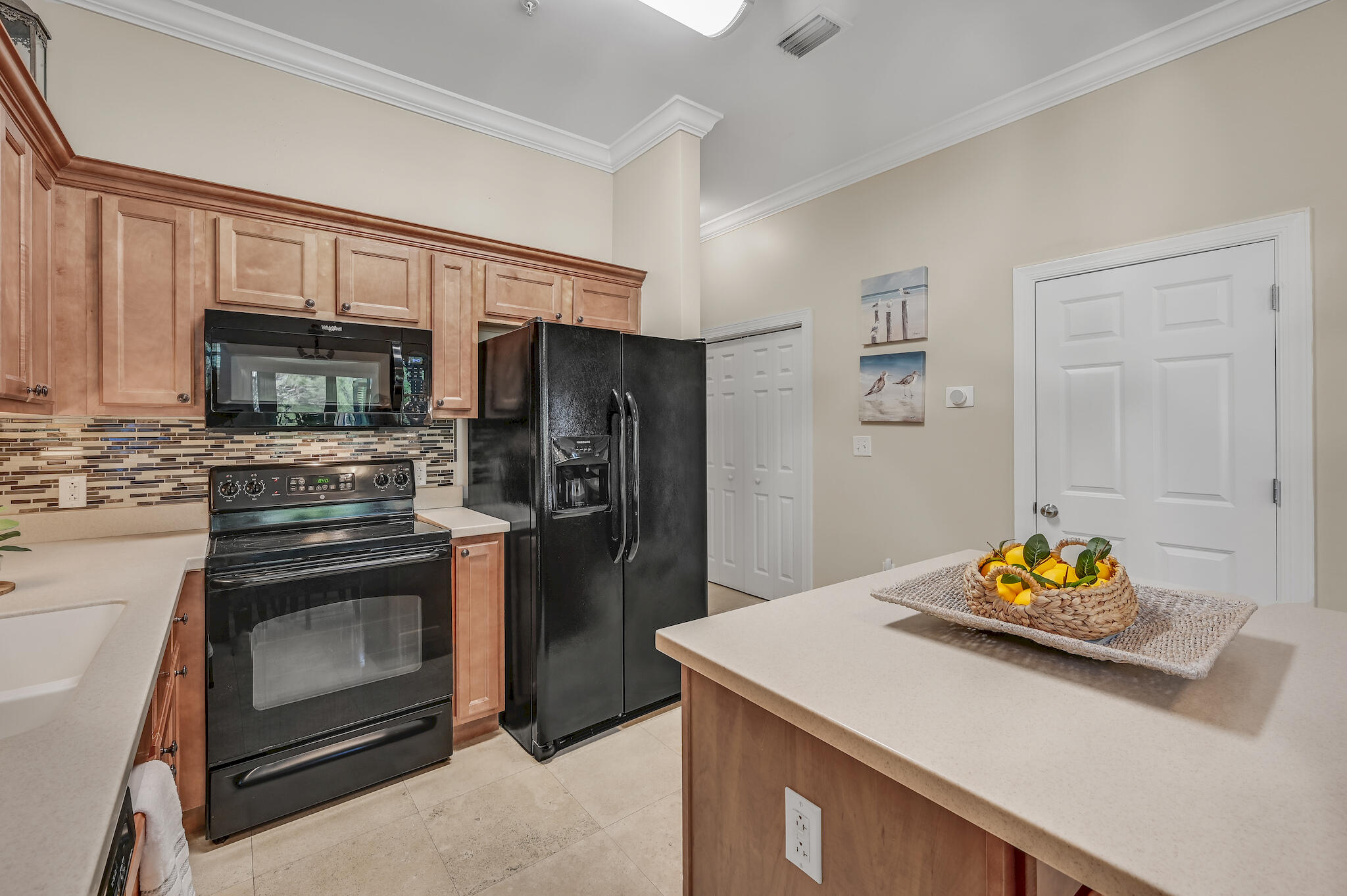 231 Somerset Bridge Road, Unit 1401 Santa Rosa Beach, FL 32459 - Photo 17 of 38 a kitchen with stainless steel appliances a stove microwave and refrigerator