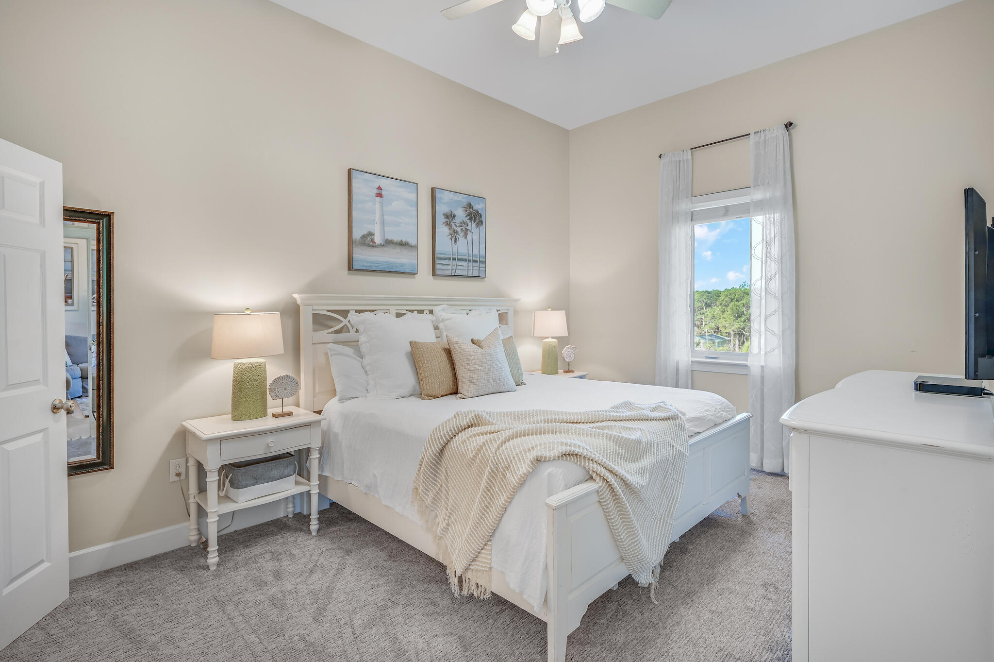 231 Somerset Bridge Road, Unit 1401 Santa Rosa Beach, FL 32459 - Photo 18 of 38 a bedroom with a bed and a chandelier