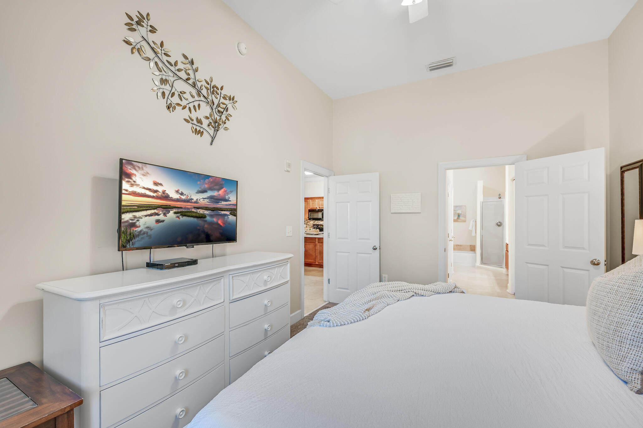 231 Somerset Bridge Road, Unit 1401 Santa Rosa Beach, FL 32459 - Photo 20 of 38 a bedroom with a bed and a flat screen tv