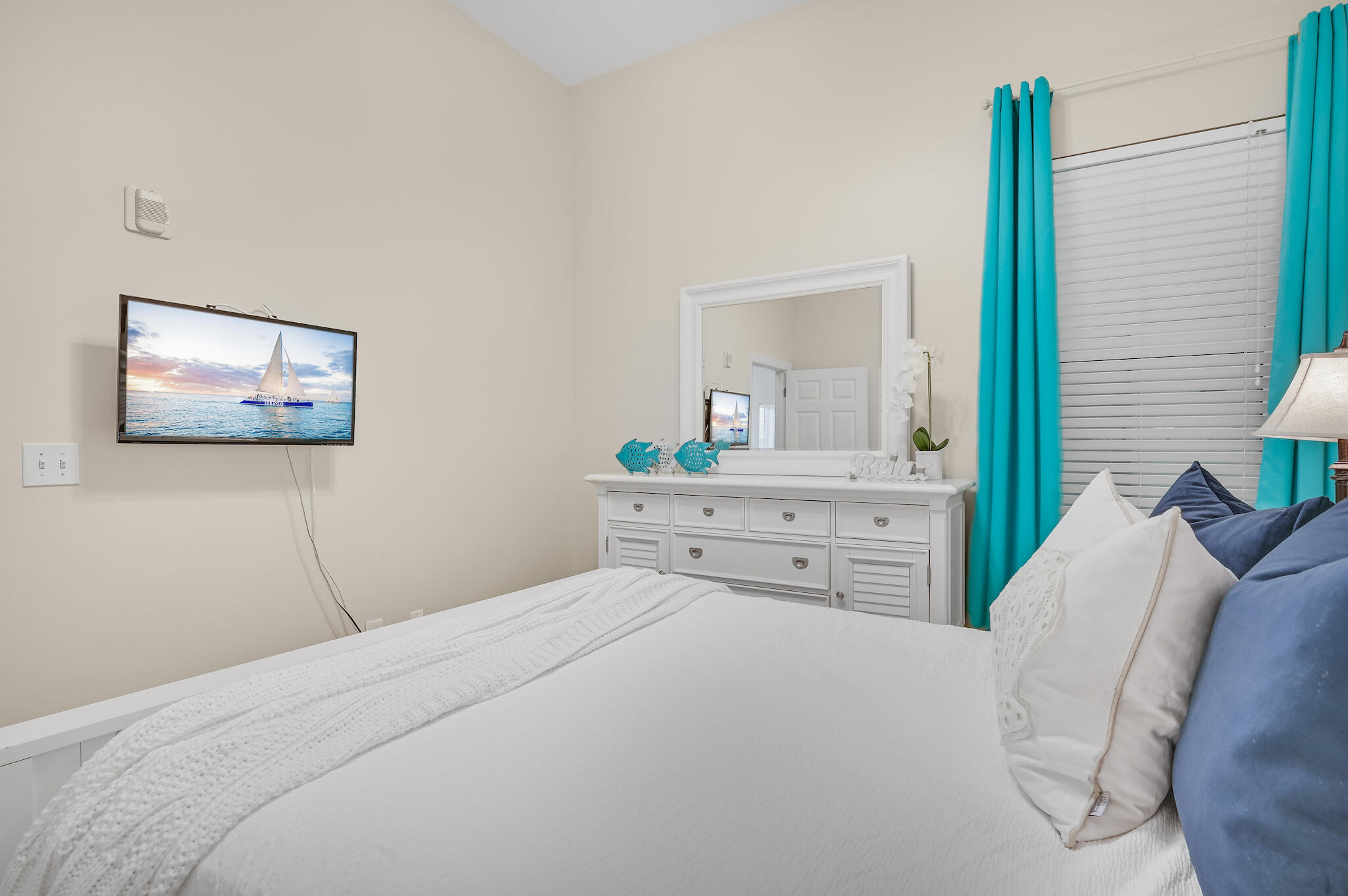 231 Somerset Bridge Road, Unit 1401 Santa Rosa Beach, FL 32459 - Photo 23 of 38 a bedroom with a bed and a large mirror