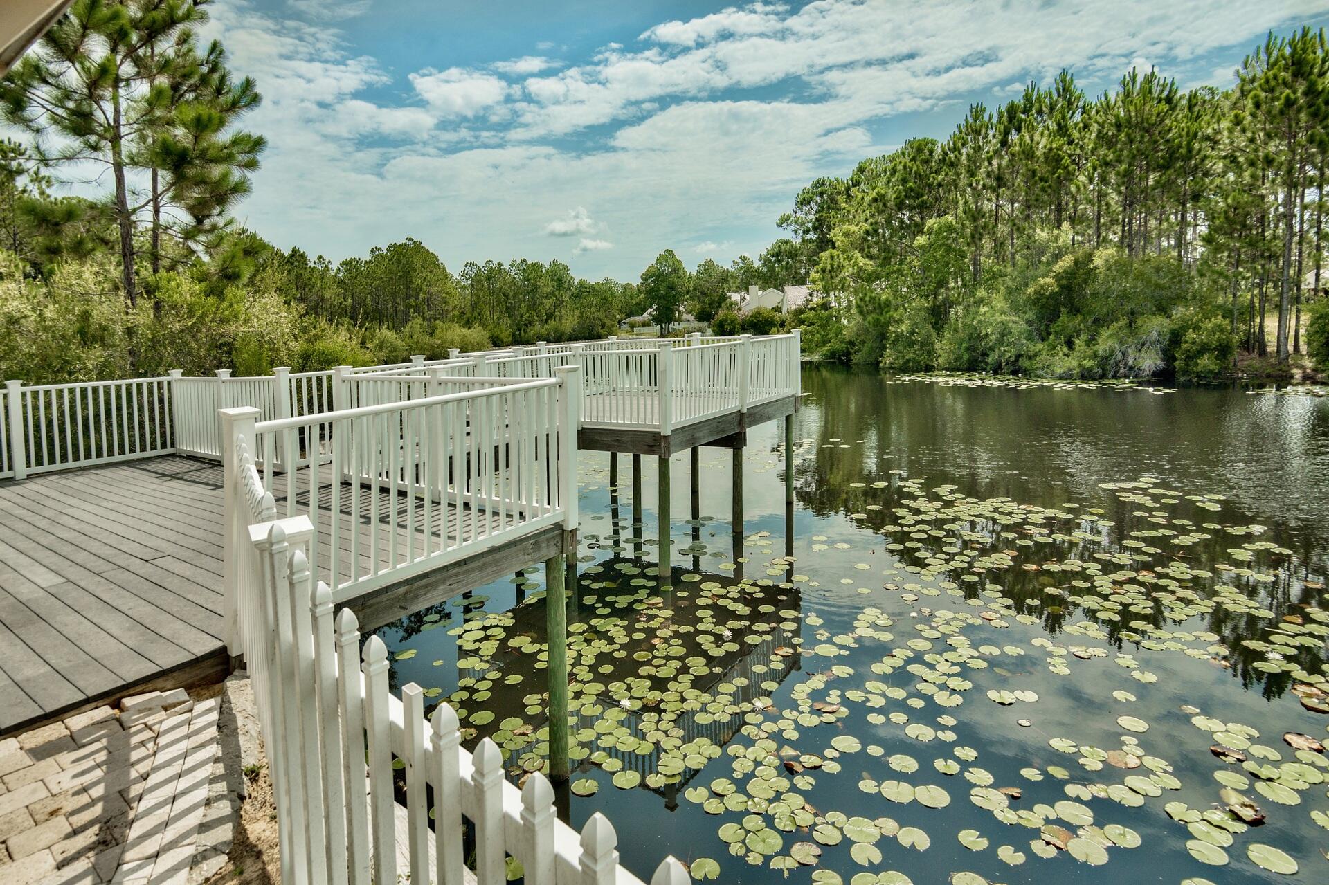 231 Somerset Bridge Road, Unit 1401 Santa Rosa Beach, FL 32459 - Photo 34 of 38 a balcony with wooden floor and fence