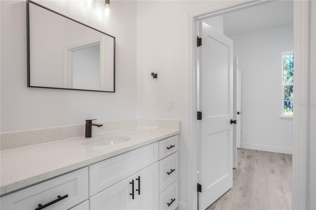 1915 West Linden Drive Dunnellon, FL 34434 - Photo 30 of 51 a bathroom with a sink and a mirror