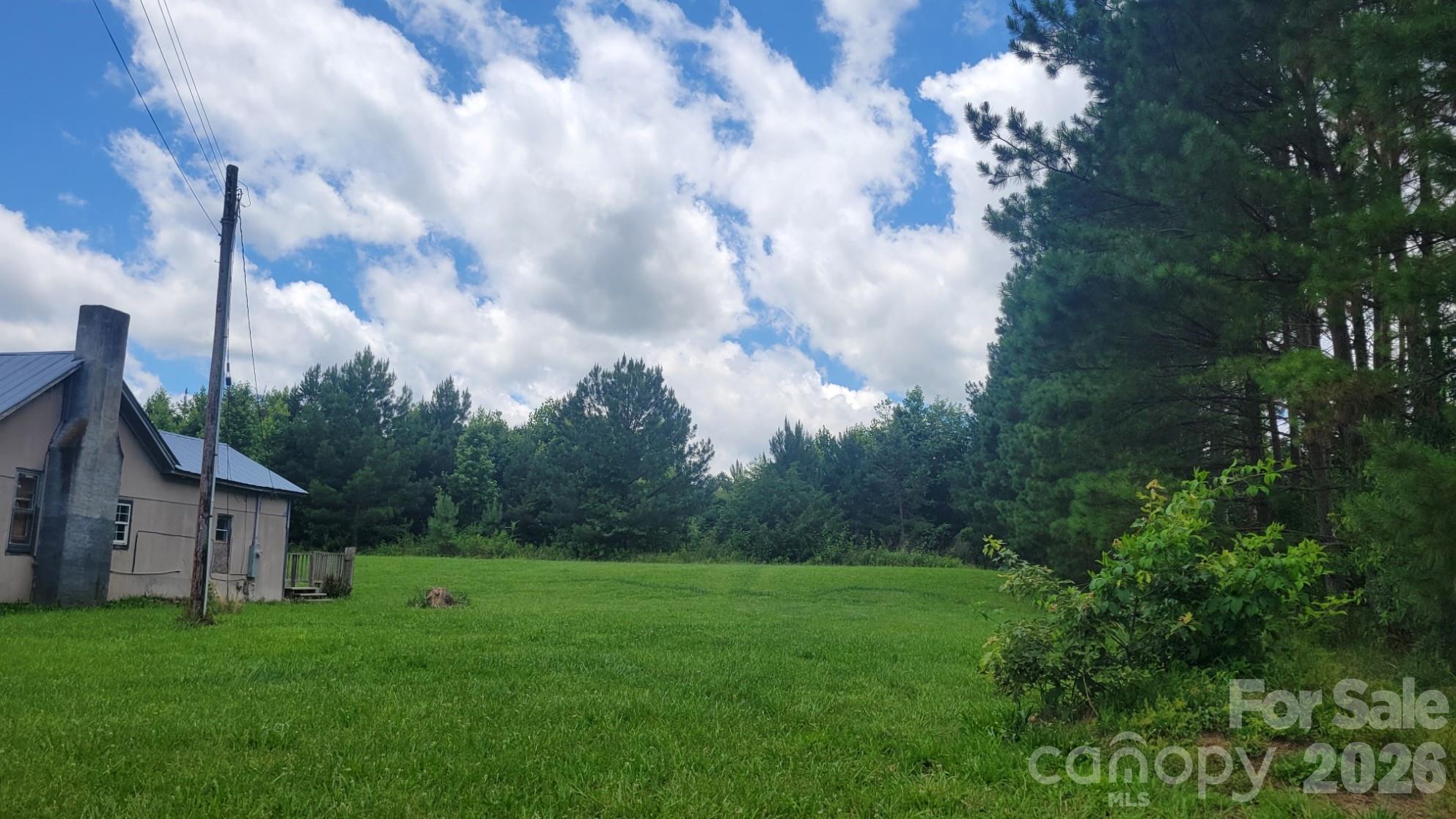 1672 Riverview Road Lincolnton, NC 28092 - Photo 5 of 16 a view of a house with backyard and garden