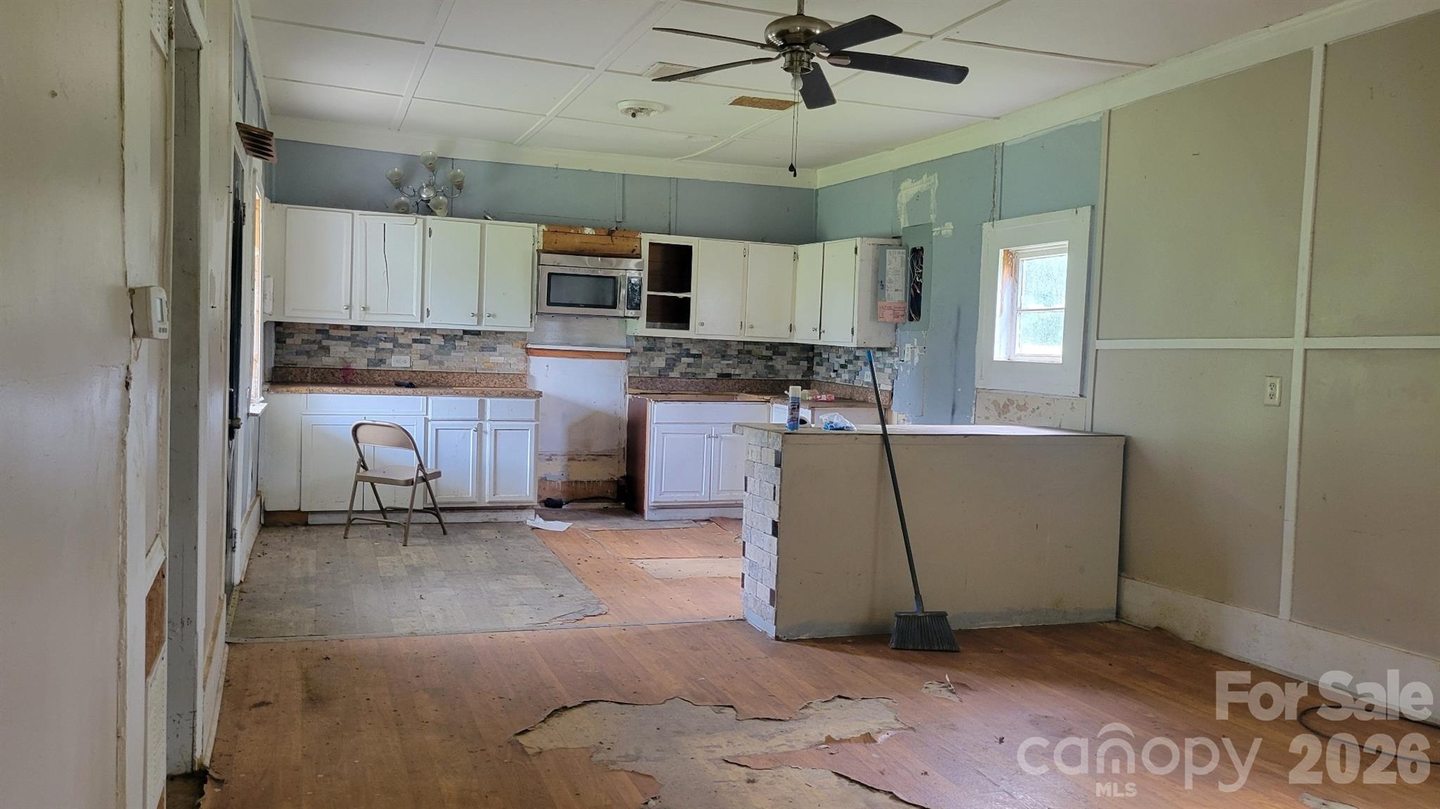 1672 Riverview Road Lincolnton, NC 28092 - Photo 10 of 16 a living room with stainless steel appliances granite countertop furniture a fireplace and a window