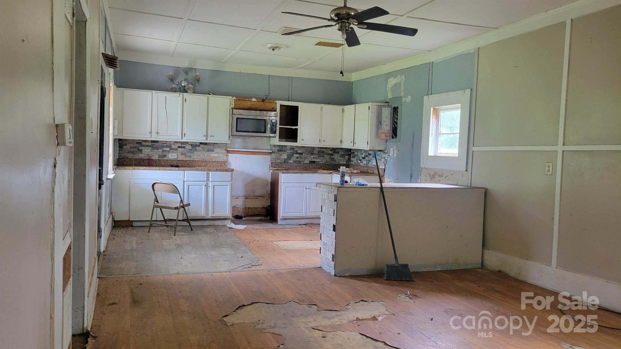 1672 Riverview Road Lincolnton, NC 28092 - Photo 10 of 15 a living room with stainless steel appliances granite countertop furniture a fireplace and a window