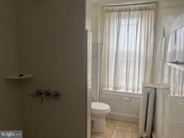 5630 Walnut Street, Unit 2 Philadelphia, PA 19139 - Photo 22 of 28 a bathroom with a toilet a sink and a window
