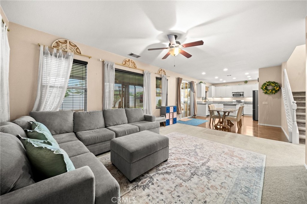 11345 Sanders Street Beaumont, CA 92223 - Photo 22 of 56 a living room with furniture and a large window