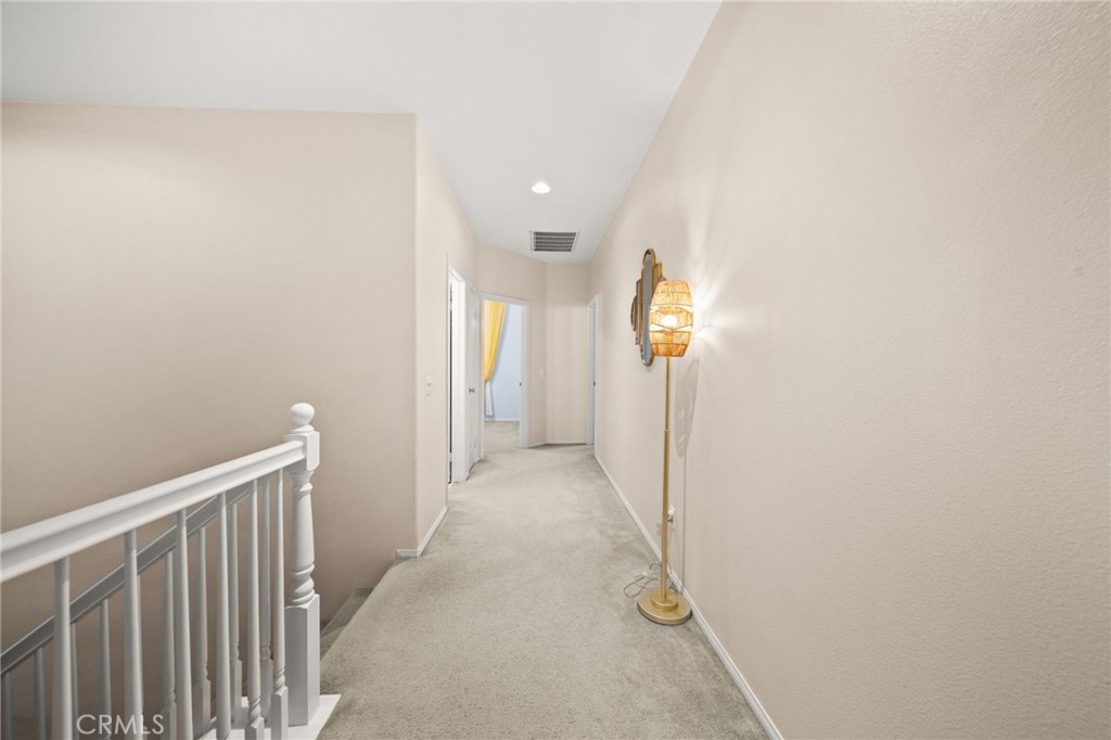 11345 Sanders Street Beaumont, CA 92223 - Photo 28 of 56 a view of a hallway with wooden floor