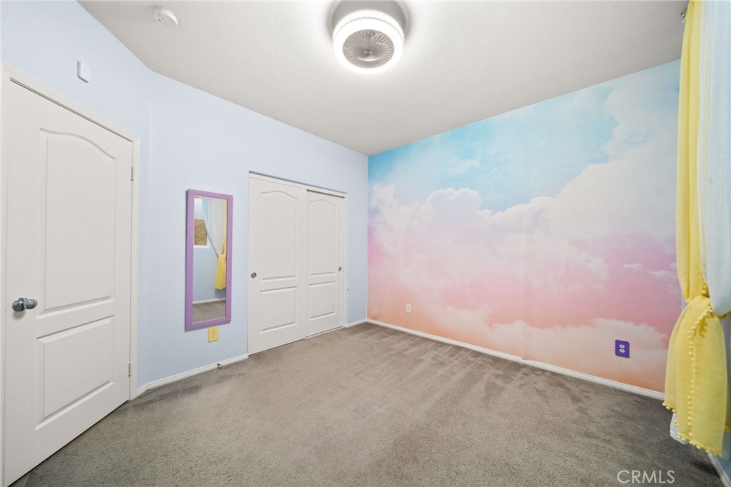 11345 Sanders Street Beaumont, CA 92223 - Photo 32 of 56 an empty room with windows