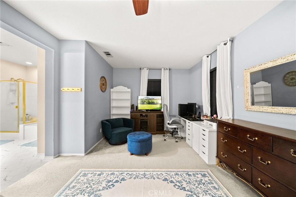 11345 Sanders Street Beaumont, CA 92223 - Photo 40 of 56 a living room with furniture and a fireplace