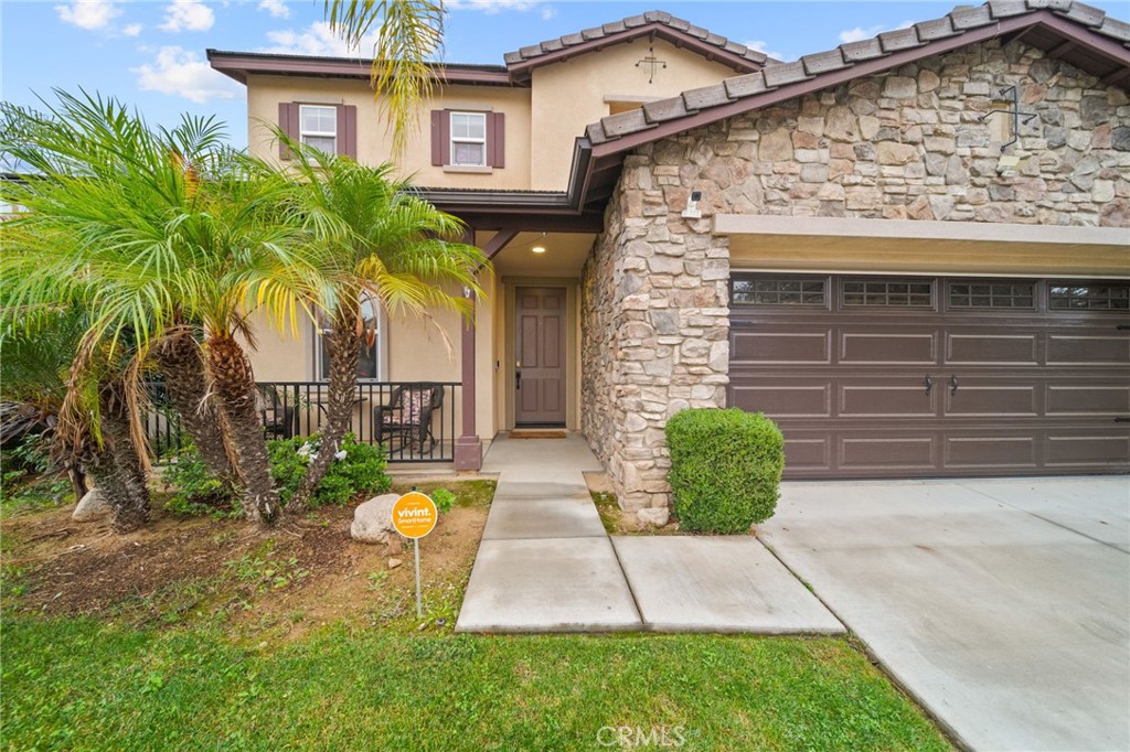 11345 Sanders Street Beaumont, CA 92223 - Photo 4 of 56 a view of a house with a patio