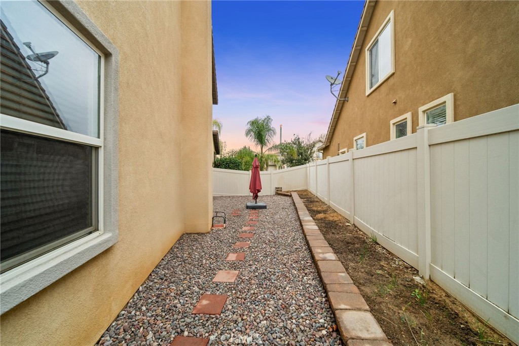 11345 Sanders Street Beaumont, CA 92223 - Photo 50 of 56 a view of a pathway of a house with wooden floor