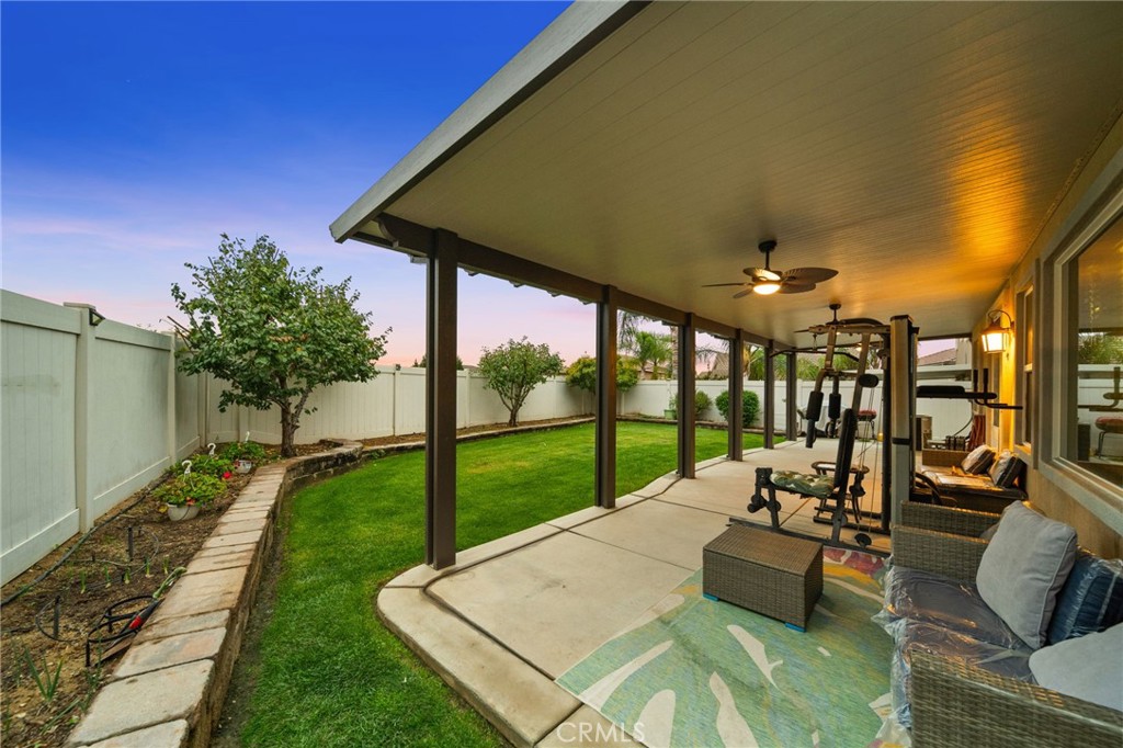 11345 Sanders Street Beaumont, CA 92223 - Photo 51 of 56 a view of a patio with couches dining table and chairs with garden view