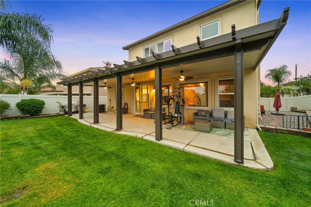 11345 Sanders Street Beaumont, CA 92223 - Photo 52 of 56 a view of a house with a yard and a patio