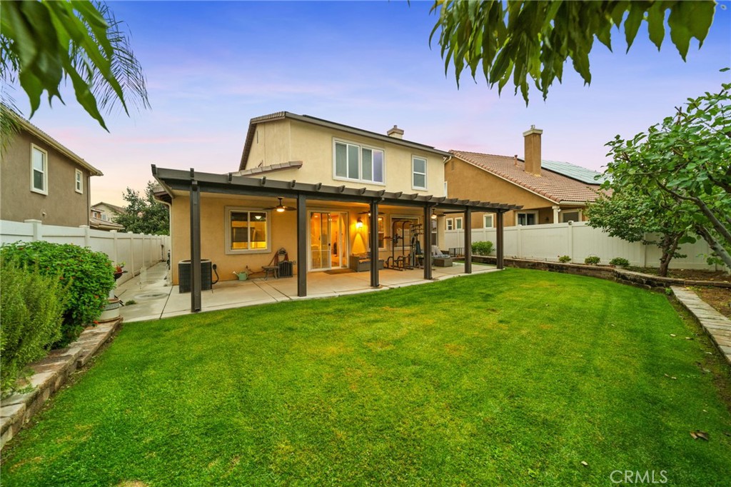 11345 Sanders Street Beaumont, CA 92223 - Photo 56 of 56 a front view of a house with a garden
