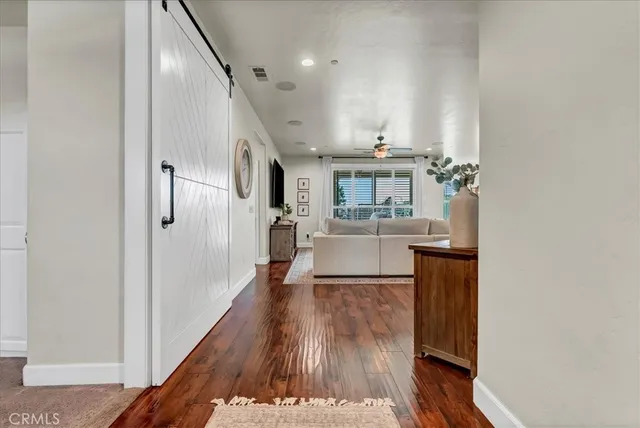 a view of a livingroom with furniture and wooden floor
