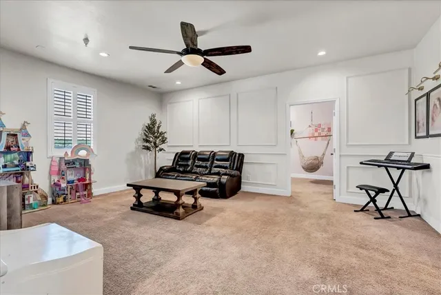 a view of livingroom with furniture and a flat screen tv