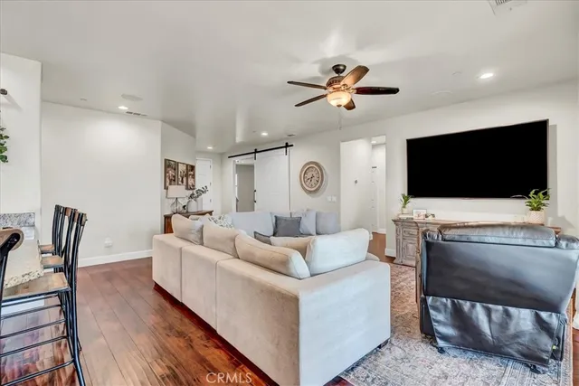 a view of a dining area with furniture and wooden floor