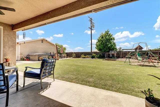 a outdoor living space with furniture and a potted plant