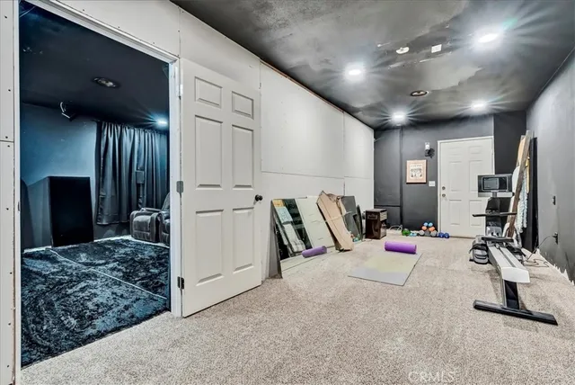 a view of a house with swimming pool and sitting area