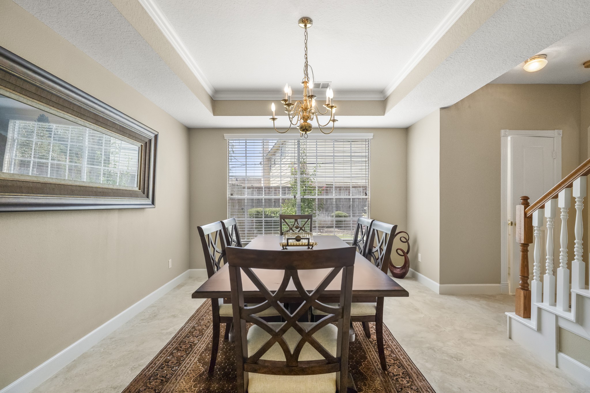 6830 Jasmine Place Spring, TX 77379 - Photo 17 of 38 a view of a dining room with furniture wooden floor and chandelier