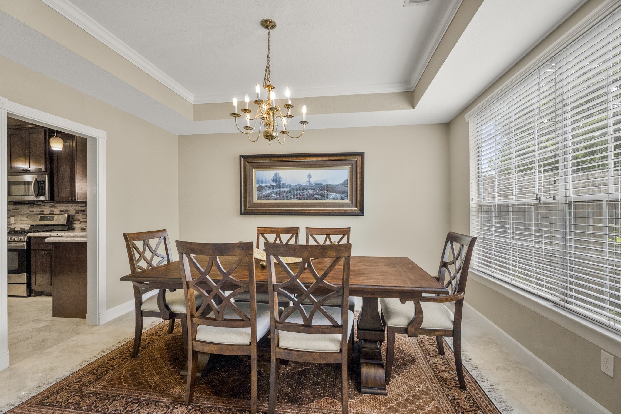6830 Jasmine Place Spring, TX 77379 - Photo 18 of 38 a view of a dining room with furniture and chandelier