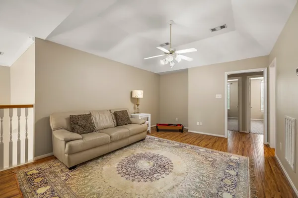 a living room with furniture and a rug