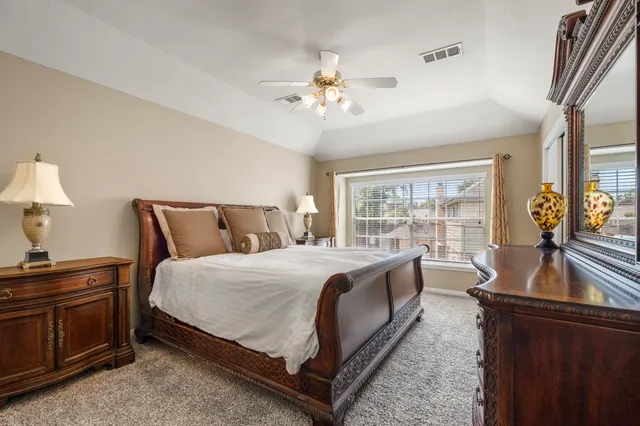 a bed room with a bed and a dresser