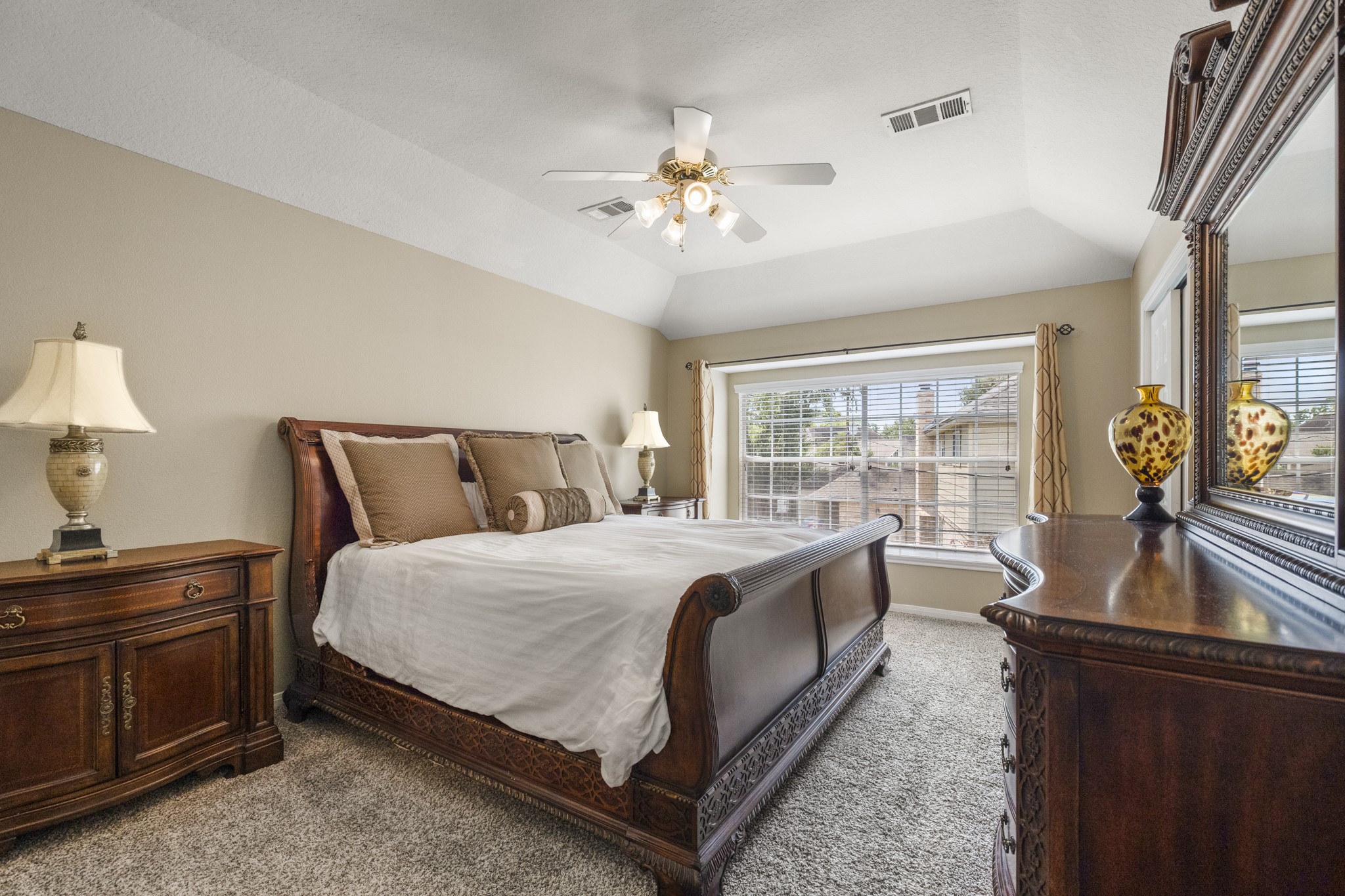 6830 Jasmine Place Spring, TX 77379 - Photo 22 of 38 a bed room with a bed and a dresser