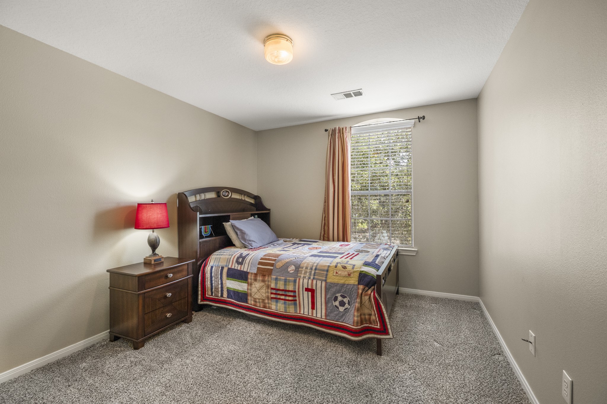 6830 Jasmine Place Spring, TX 77379 - Photo 27 of 38 a bedroom with a bed and a window