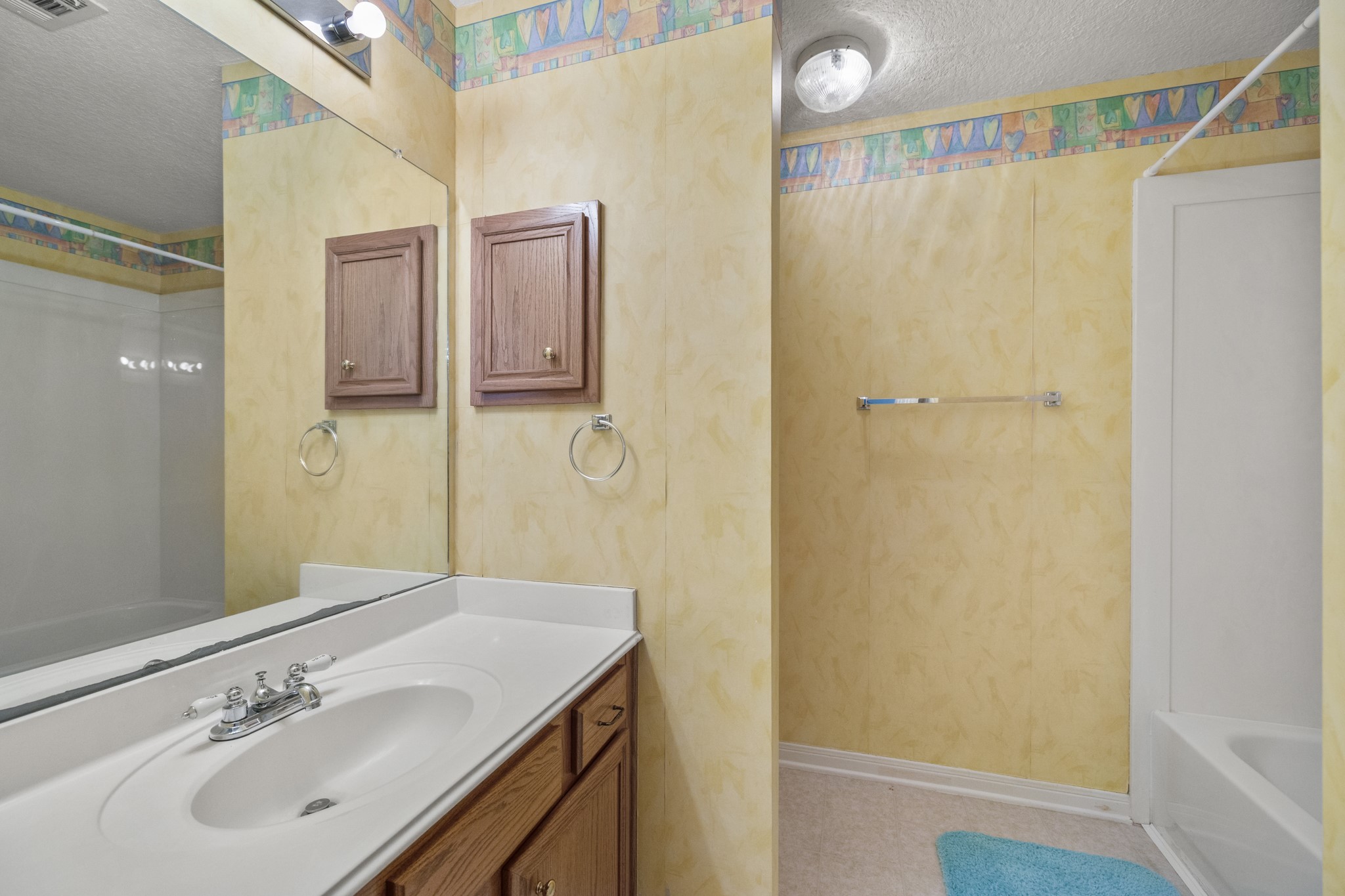 6830 Jasmine Place Spring, TX 77379 - Photo 29 of 38 a bathroom with a sink and a mirror