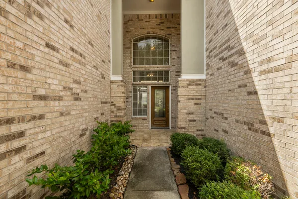 a view of a pathway with a small yard