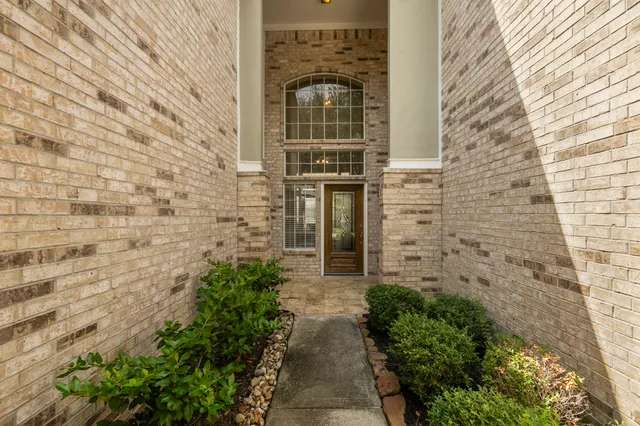 a view of a pathway with a small yard